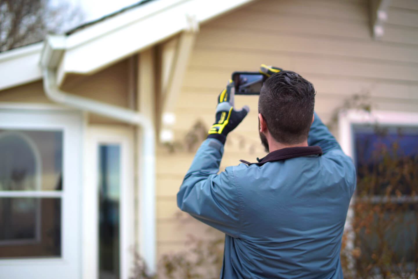 Inspecting exterior during a Denver residential rental property license inspection