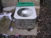 A/C condenser cemented to the ground