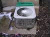 A/C condenser cemented to the ground